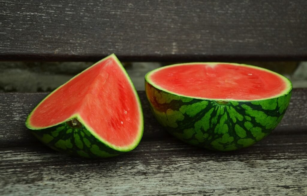 Cut watermelon into 2 pieces