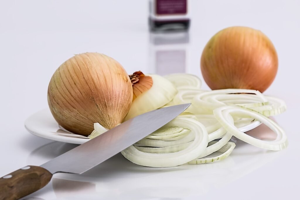 Onion slice with knife and keep in a plate