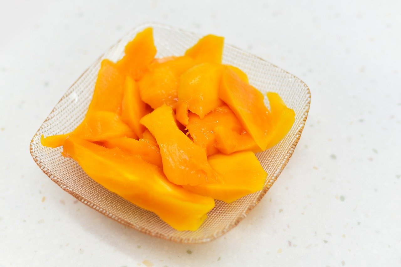 Cut Mango into different pieces and put in a bowl