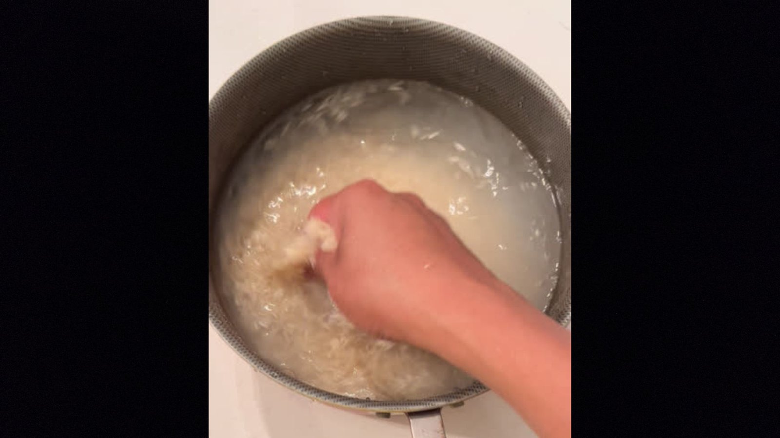 Rinsing rice in a bowl for removing extra Strach