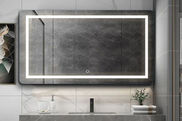 A black bathroom mirror with surrounded by LED lights