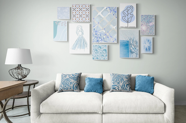 living room decorated with blue and white gallery wall