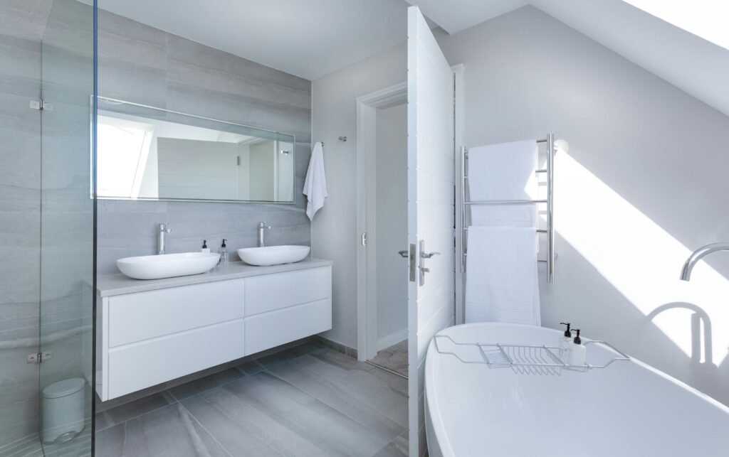 bathroom 60-inch vanity with bathtub and twin sinks, showcasing minimalist design and luxury.