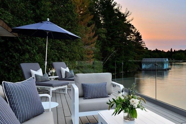 pool side chairs, table, cushions seat on the floor representing Poolside Furniture Ideas