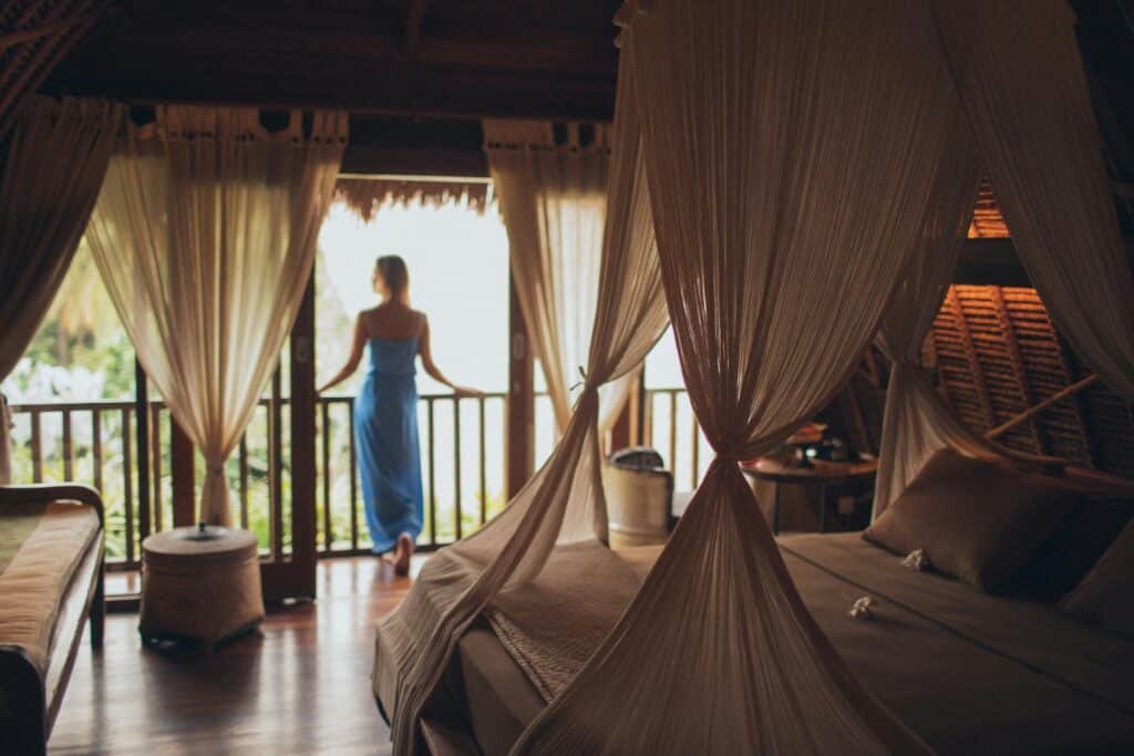 Peaceful bedroom with balcony view, perfect for relaxation representing that How to Choose Right Curtains for My Home?