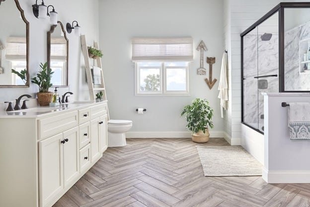 a bathroom where three mirrors, one table, one comet, tree, shower place